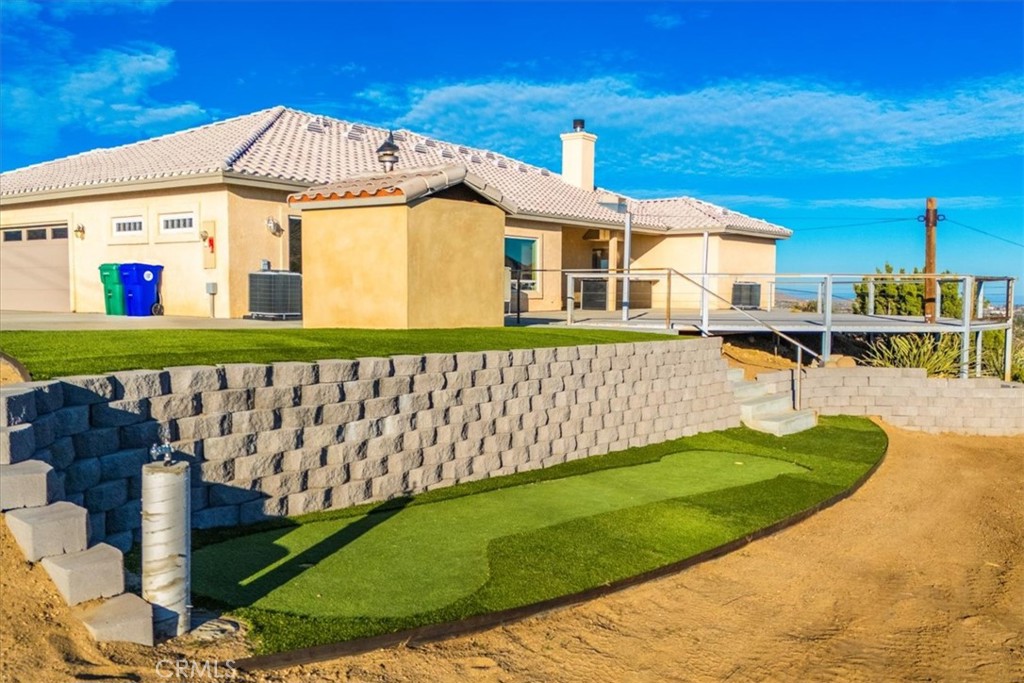 7959 Stephenson Lane Yucca Valley, CA 92284 - Photo 72 of 75 a front view of a house with a yard