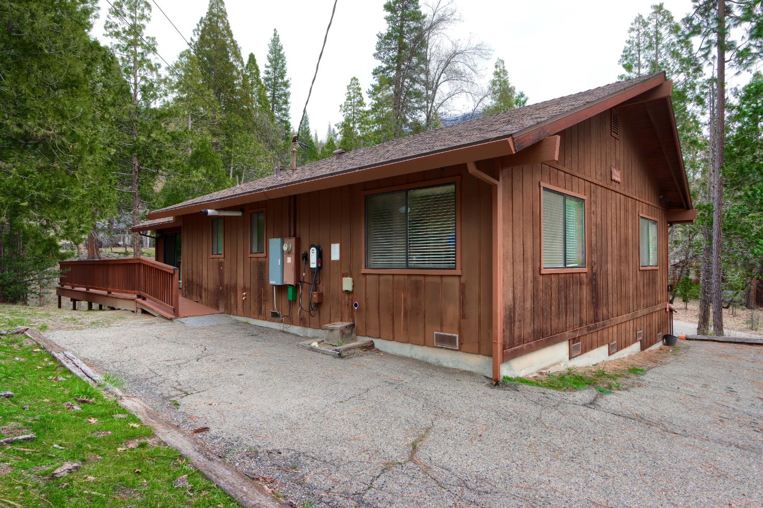 8041 Chilnualna Falls Road Wawona, CA 95389 - Photo 36 of 46 a view of a house with backyard and trees