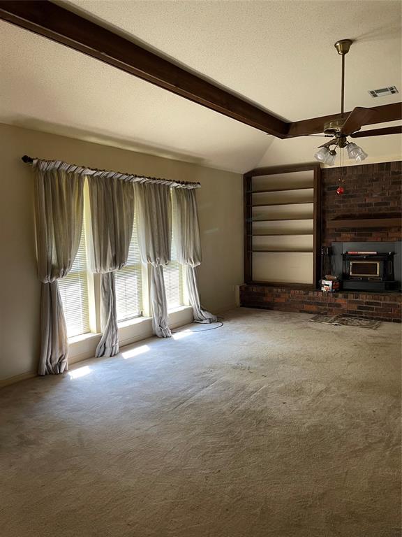 122 Post Oak Drive Mansfield, LA 71052 - Photo 11 of 23 Unfurnished living room featuring carpet floors, a textured ceiling, and ceiling fan