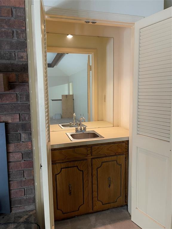 122 Post Oak Drive Mansfield, LA 71052 - Photo 14 of 23 Bathroom with vanity and brick wall