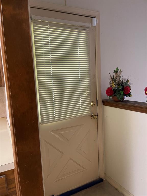 122 Post Oak Drive Mansfield, LA 71052 - Photo 8 of 23 Doorway to outside with baseboards