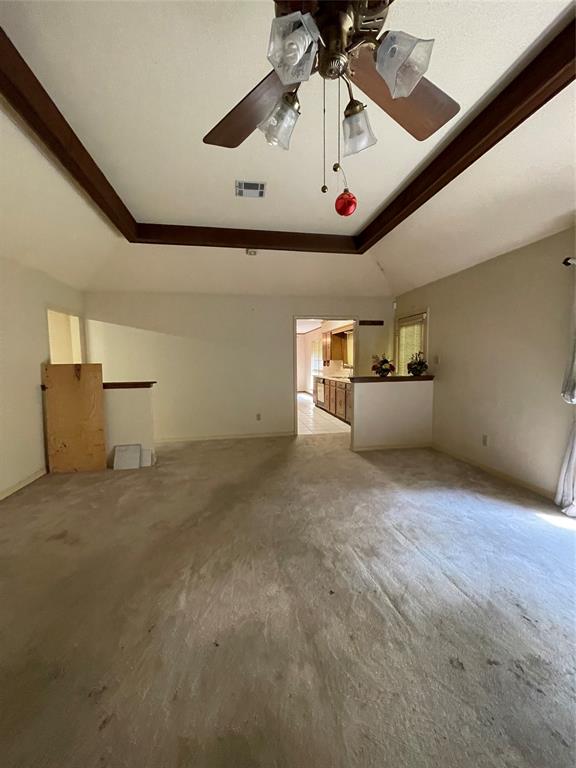 122 Post Oak Drive Mansfield, LA 71052 - Photo 10 of 23 Unfurnished living room featuring a raised ceiling and carpet