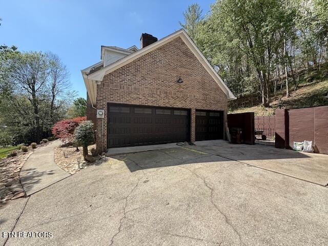103 Amanda Place Oak Ridge, TN 37830 - Photo 2 of 38 a front view of a house with a yard and garage