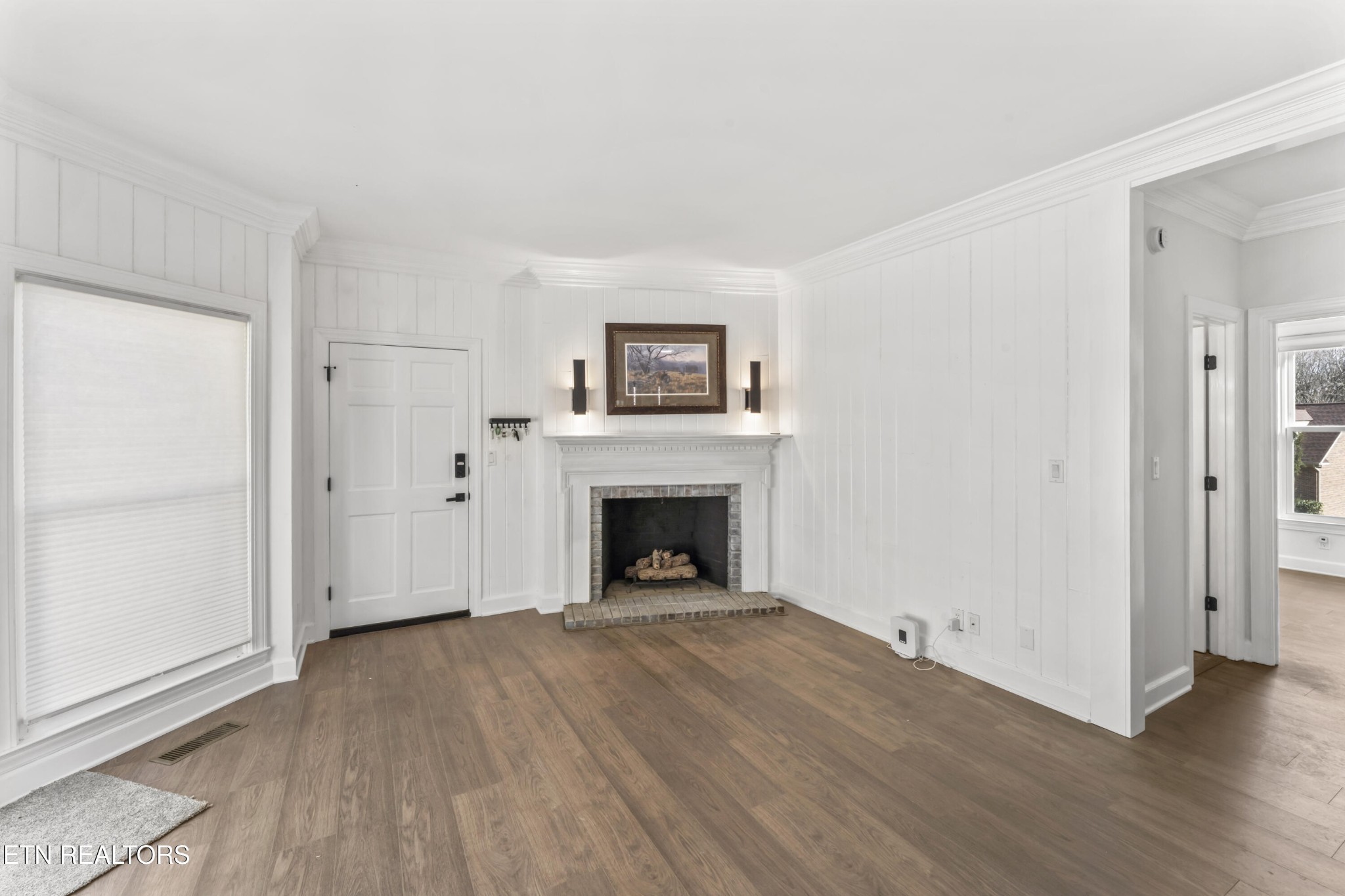 103 Amanda Place Oak Ridge, TN 37830 - Photo 5 of 38 wooden floor fireplace and windows in an empty room
