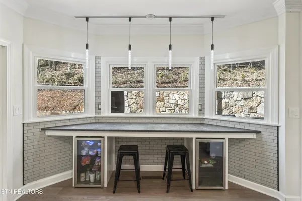 a view of a kitchen with furniture and windows