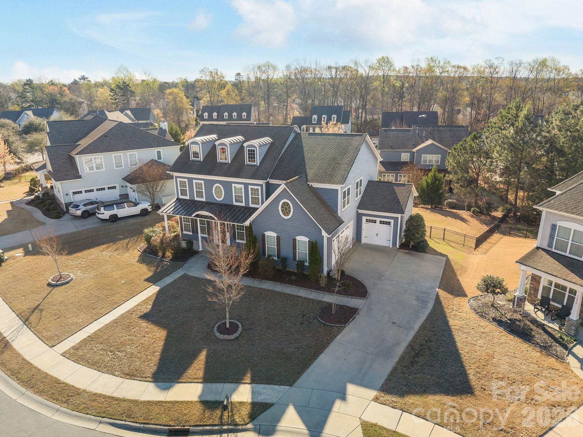 an aerial view of a house with a garden
