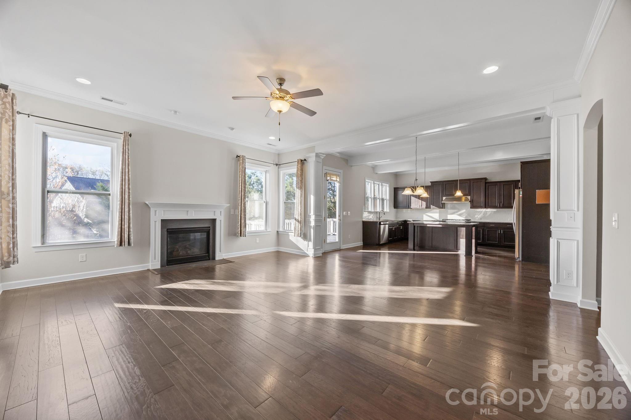 1221 Violet Court Fort Mill, SC 29708 - Photo 12 of 48 a view of an empty room with chandelier fan and fire place