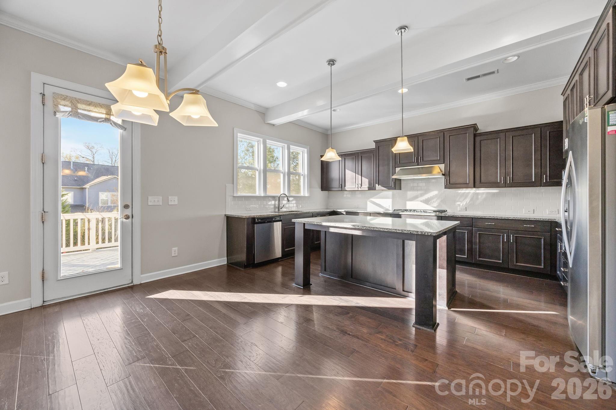 1221 Violet Court Fort Mill, SC 29708 - Photo 16 of 48 a kitchen with stainless steel appliances granite countertop a stove a sink and a refrigerator