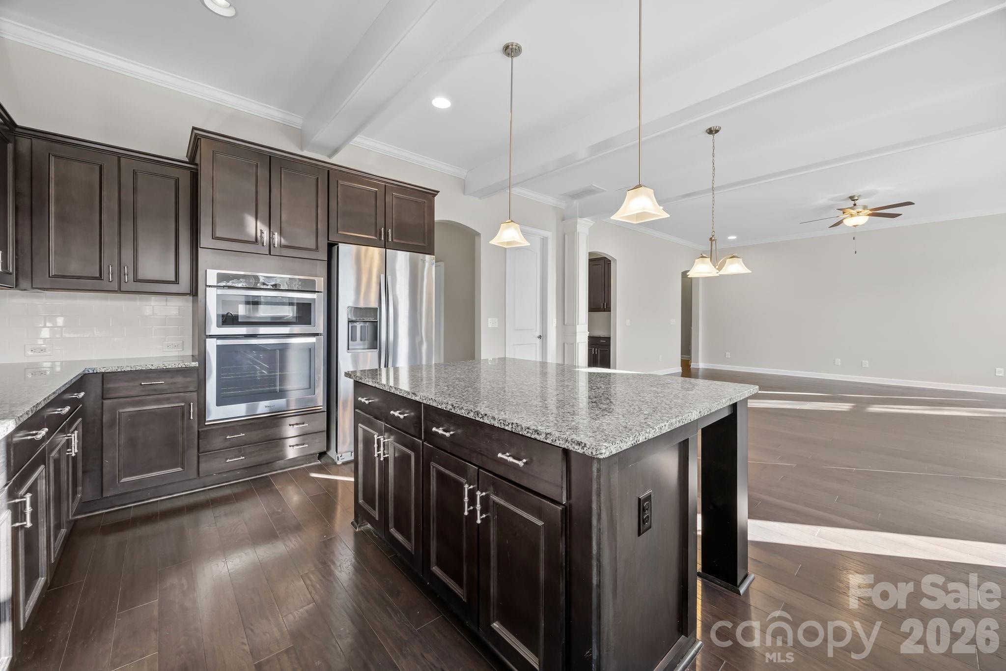 1221 Violet Court Fort Mill, SC 29708 - Photo 18 of 48 a kitchen with stainless steel appliances granite countertop a kitchen island a stove and a refrigerator