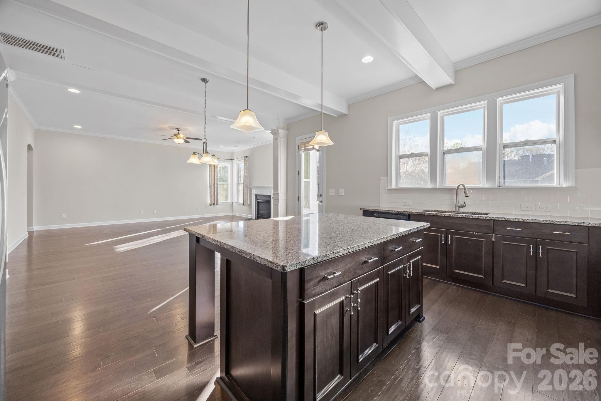 1221 Violet Court Fort Mill, SC 29708 - Photo 19 of 48 a kitchen with granite countertop a sink a counter space appliances and cabinets