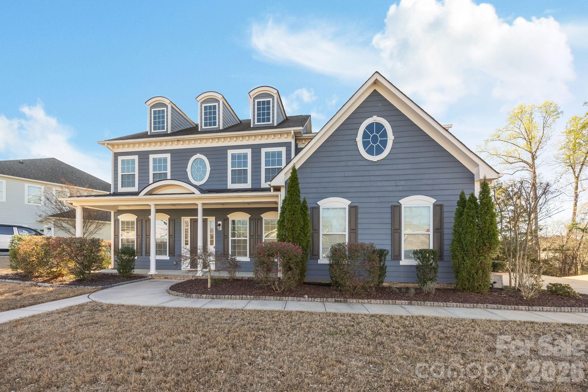 1221 Violet Court Fort Mill, SC 29708 - Photo 2 of 48 a front view of a house with garden
