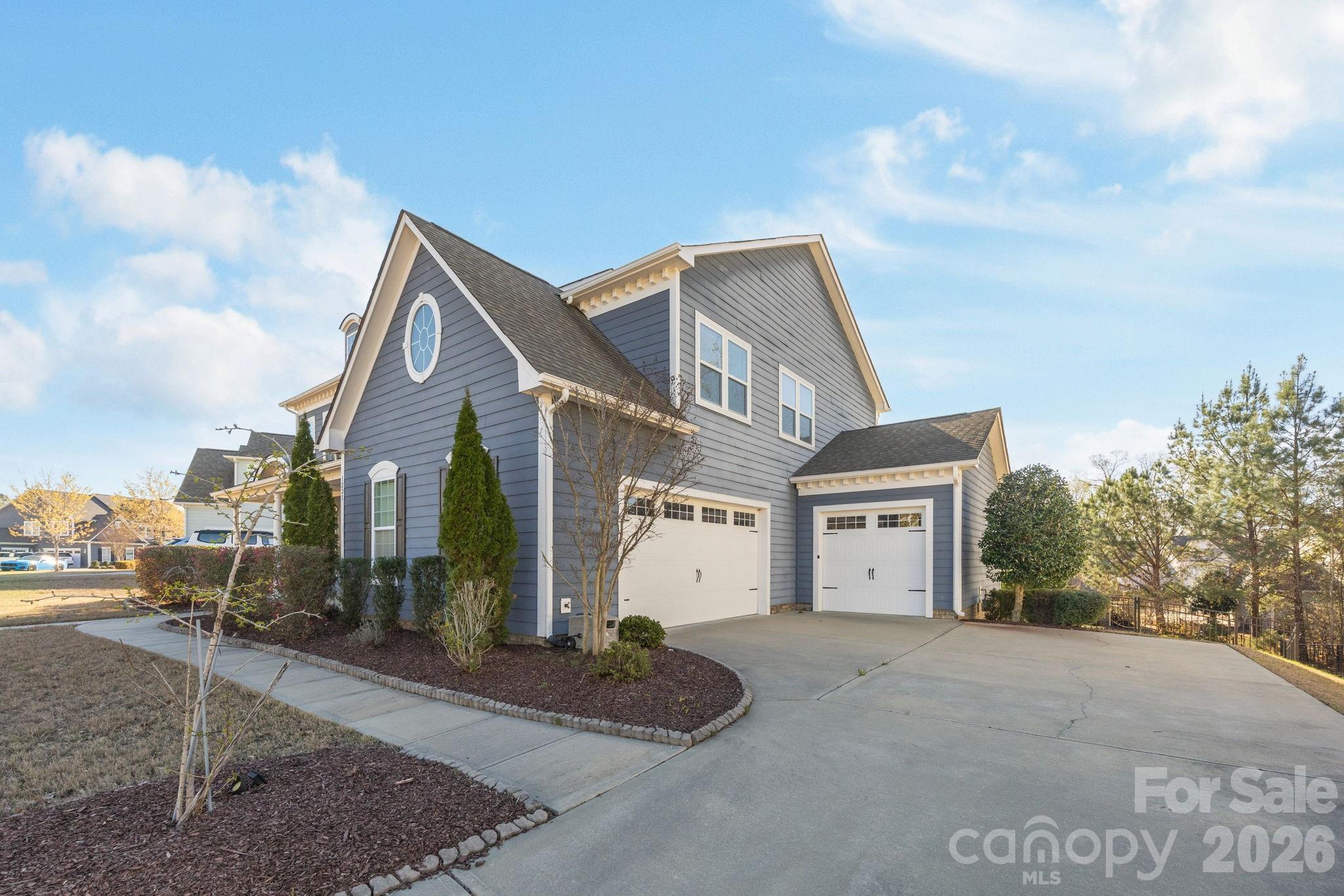 1221 Violet Court Fort Mill, SC 29708 - Photo 3 of 48 a front view of a house with a yard