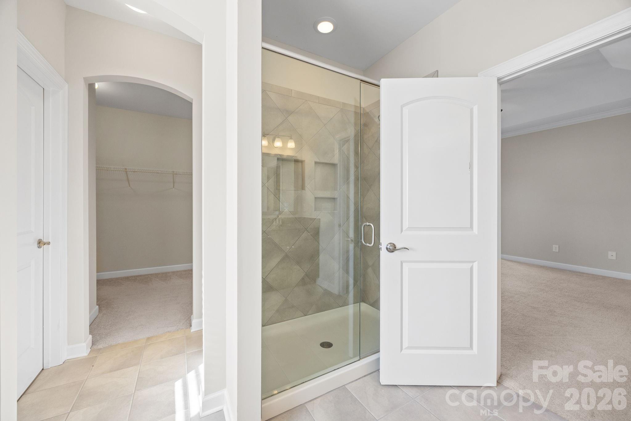 1221 Violet Court Fort Mill, SC 29708 - Photo 32 of 48 a bathroom with a glass shower door and a sink