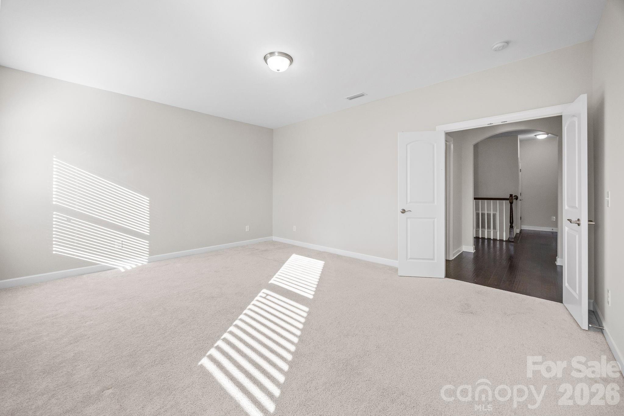 1221 Violet Court Fort Mill, SC 29708 - Photo 35 of 48 a view of a bedroom with wooden floor and bathroom