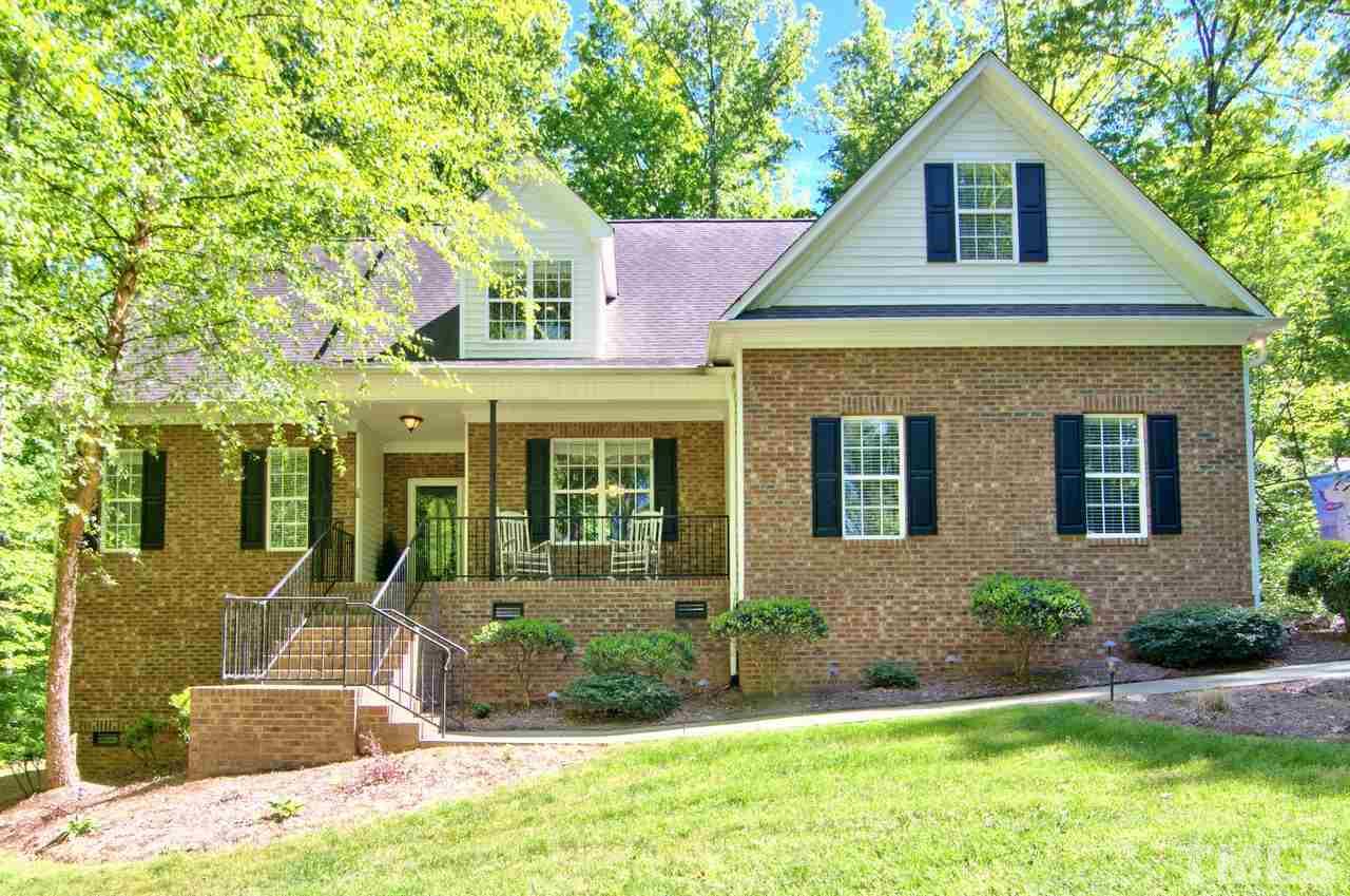 28 Finish Line Road Bahama, NC 27503 - Photo 1 of 25 a front view of a house with a yard