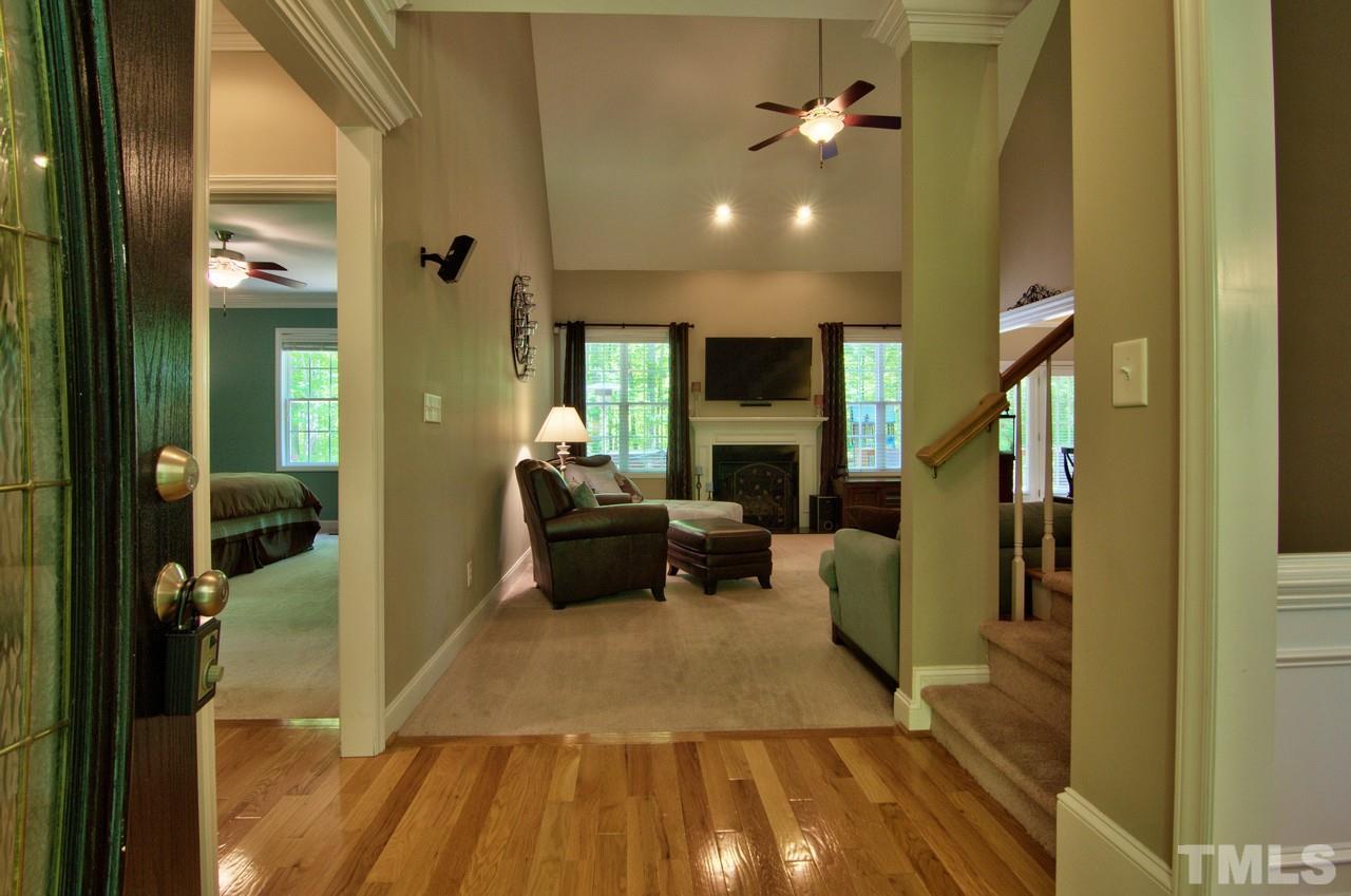 28 Finish Line Road Bahama, NC 27503 - Photo 11 of 25 a living room with furniture and a fireplace