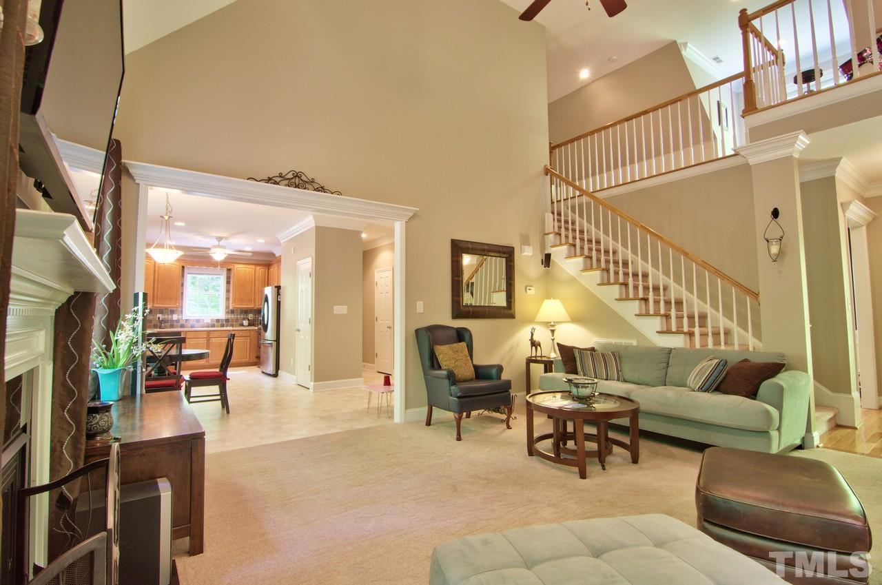 28 Finish Line Road Bahama, NC 27503 - Photo 17 of 25 a living room with furniture and a dining table with rug floor