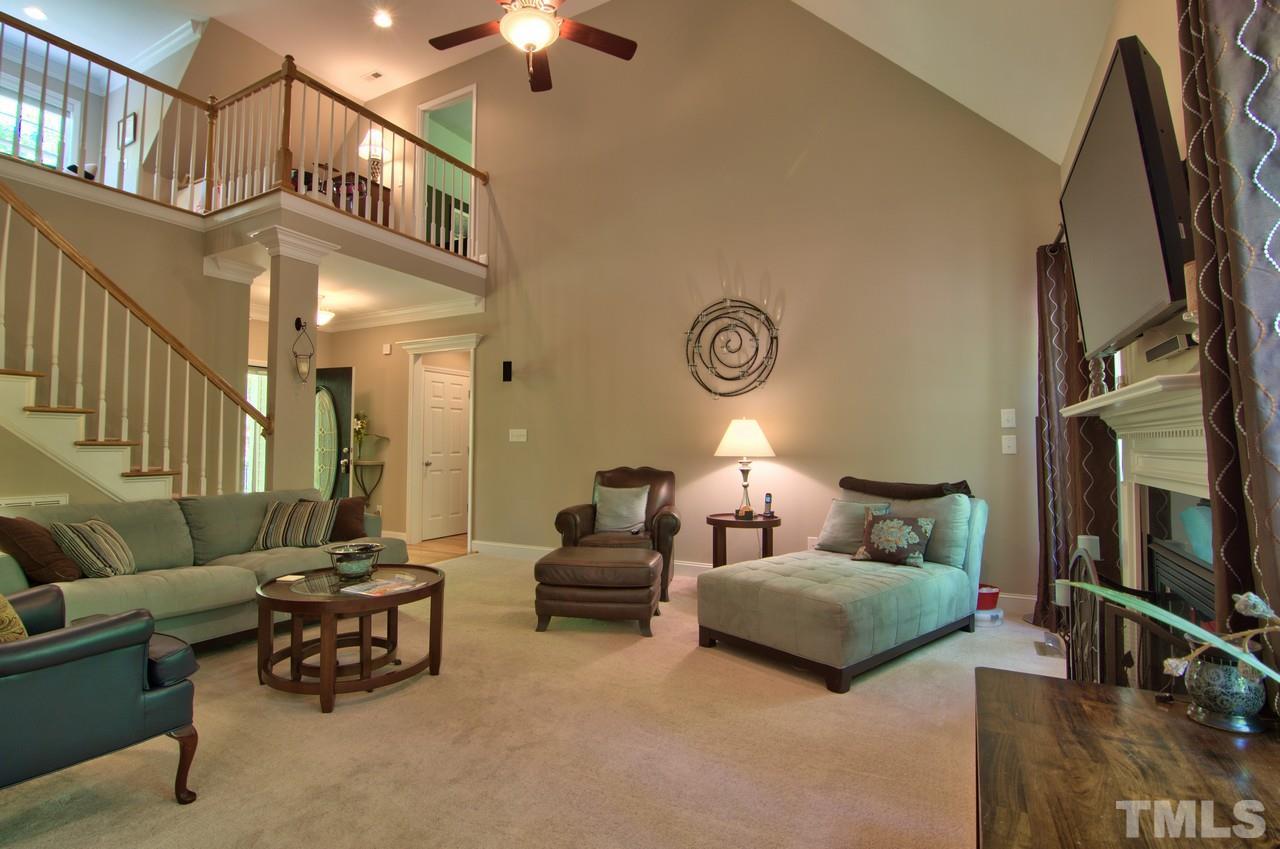 28 Finish Line Road Bahama, NC 27503 - Photo 18 of 25 a living room with furniture and a flat screen tv