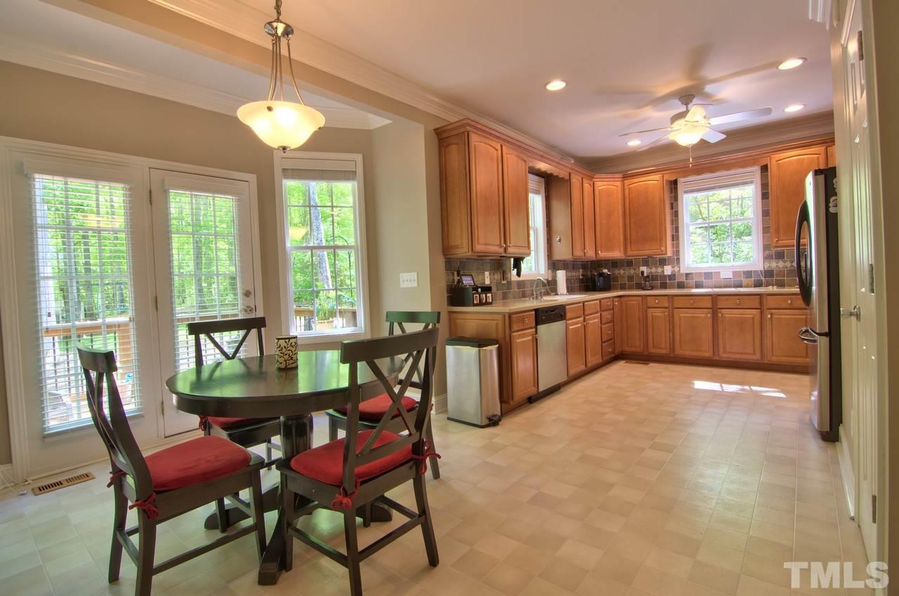 28 Finish Line Road Bahama, NC 27503 - Photo 19 of 25 a view of a dining room with furniture window and outside view