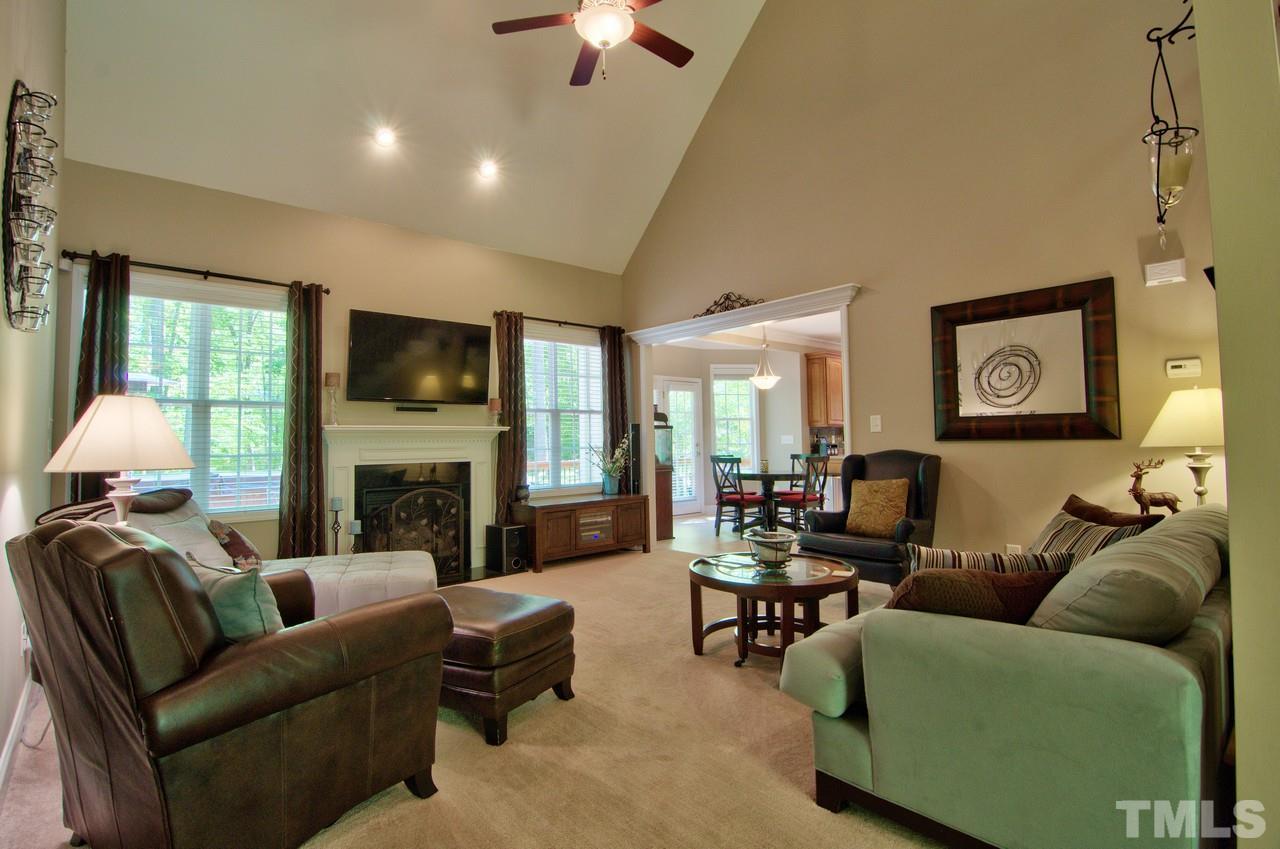28 Finish Line Road Bahama, NC 27503 - Photo 3 of 25 a living room with furniture fireplace and a flat screen tv