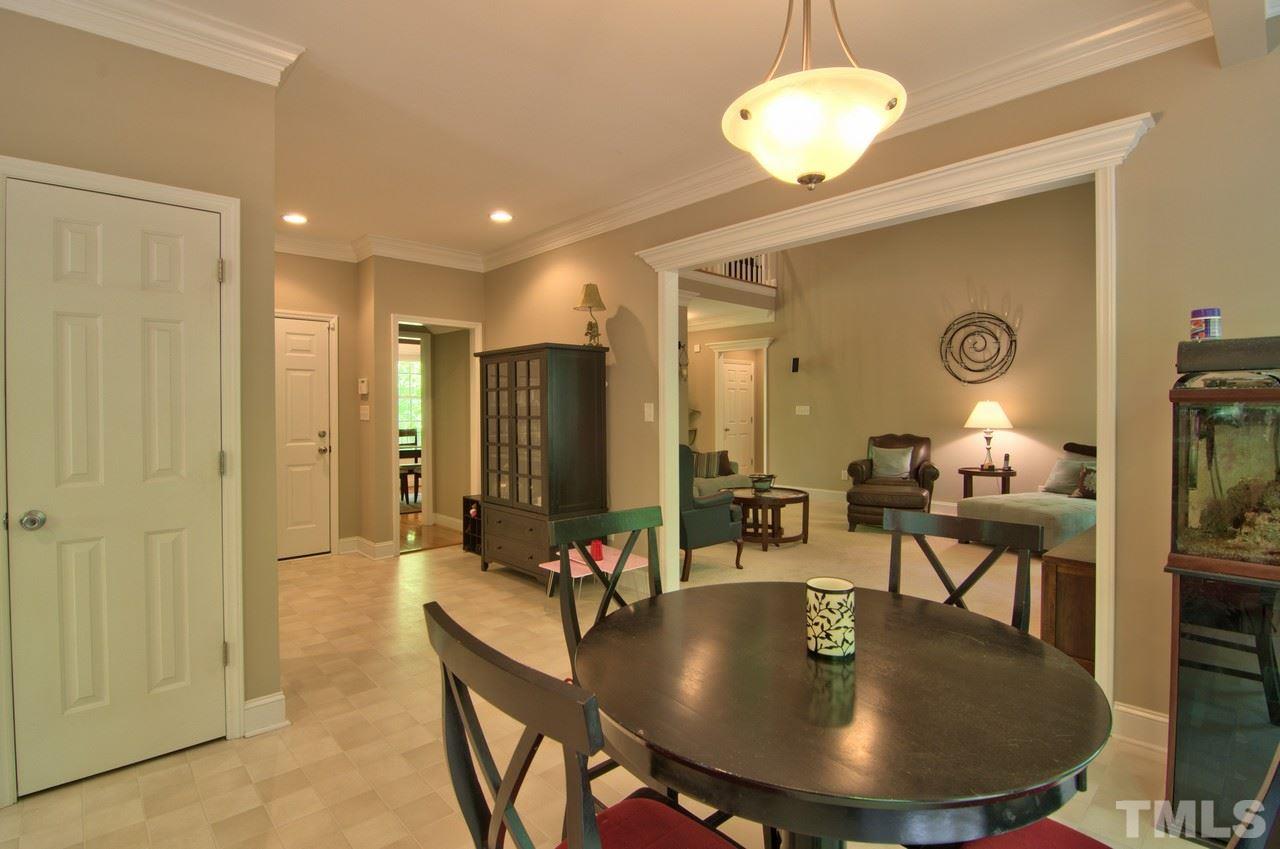 28 Finish Line Road Bahama, NC 27503 - Photo 21 of 25 a dining room with furniture and a chandelier