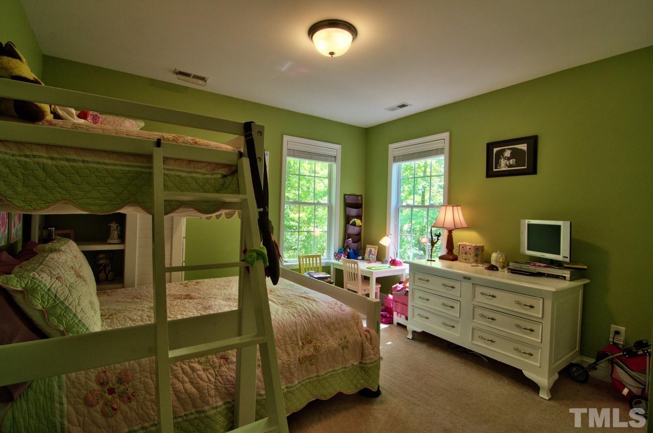 28 Finish Line Road Bahama, NC 27503 - Photo 23 of 25 a bed room with a bed and a window