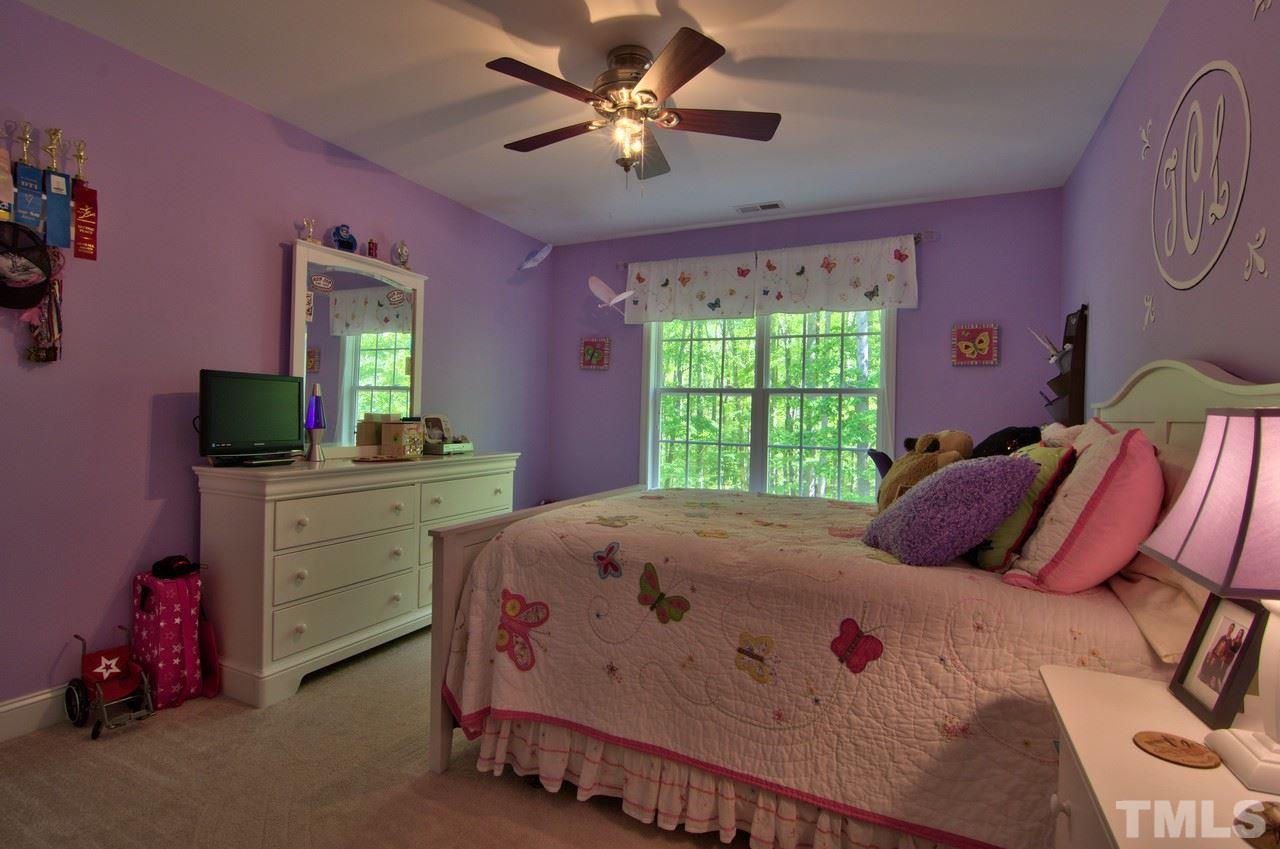 28 Finish Line Road Bahama, NC 27503 - Photo 24 of 25 a bedroom with a bed and a dresser