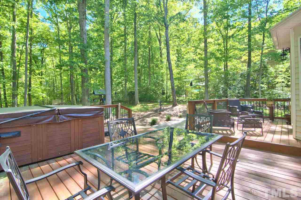 28 Finish Line Road Bahama, NC 27503 - Photo 8 of 25 a view of a chairs and table in the patio