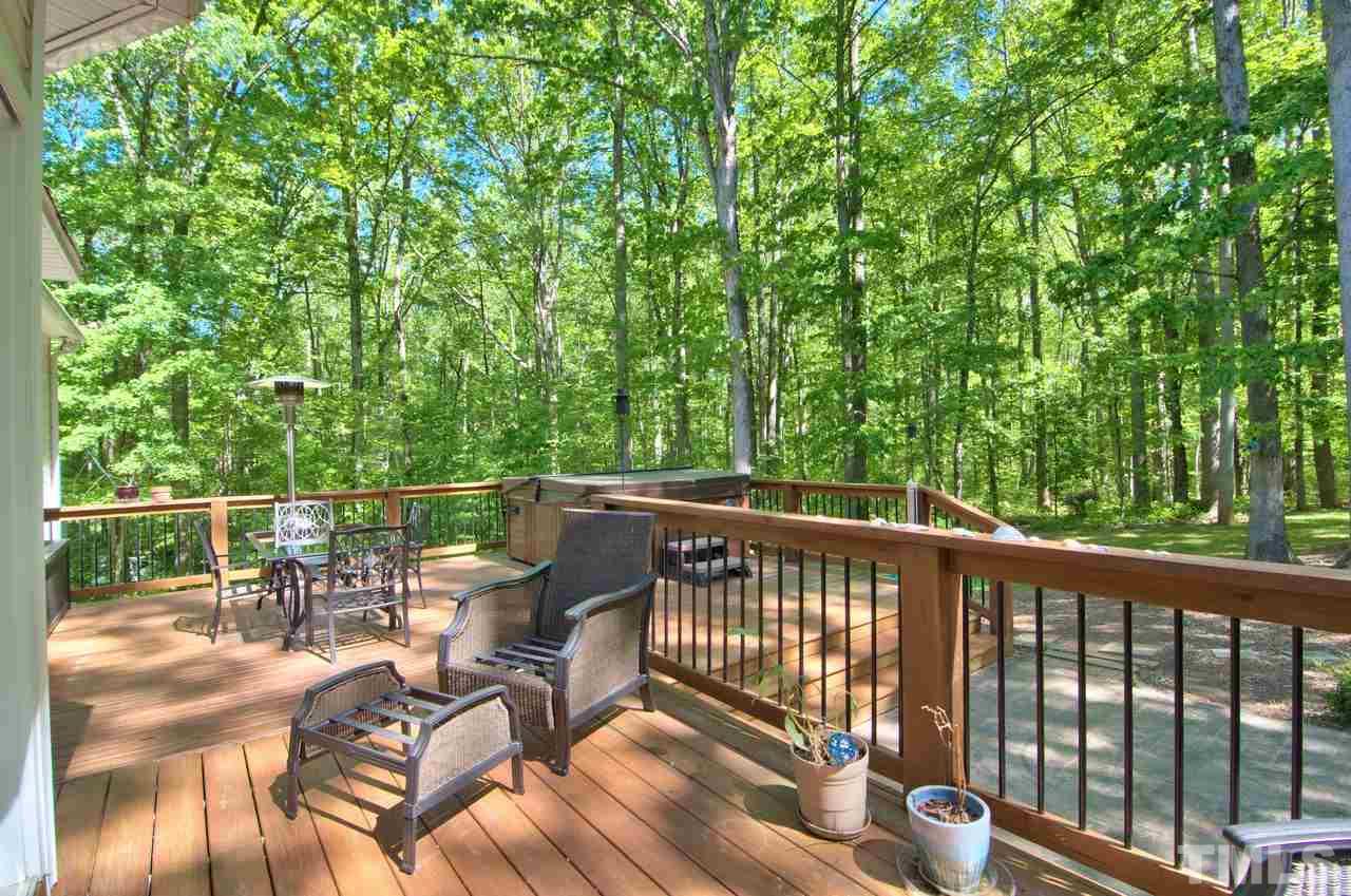 28 Finish Line Road Bahama, NC 27503 - Photo 9 of 25 a view of balcony with furniture and trees in the background