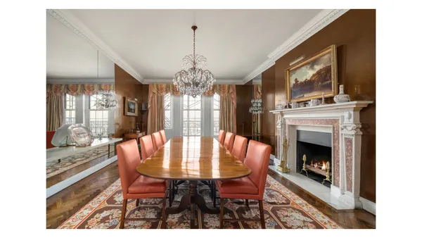 a living room with furniture a window and a fireplace