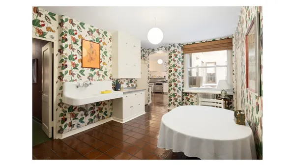 a view of a kitchen with a sink and cabinets