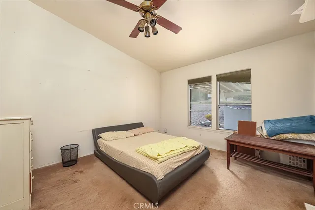 a bedroom with a bed and window