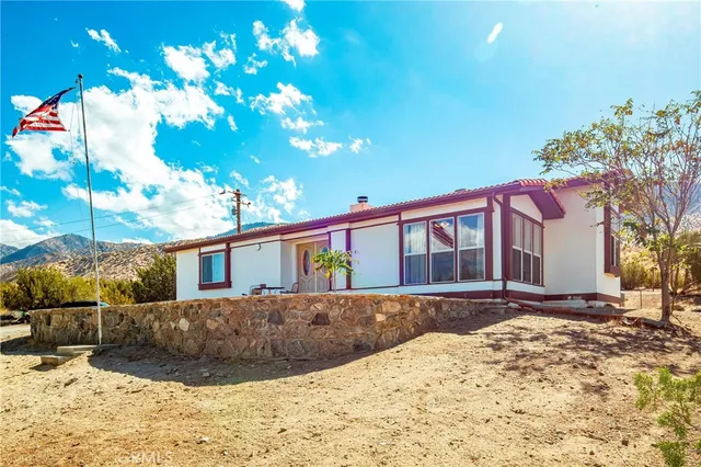 a view of a house with a snow in the yard