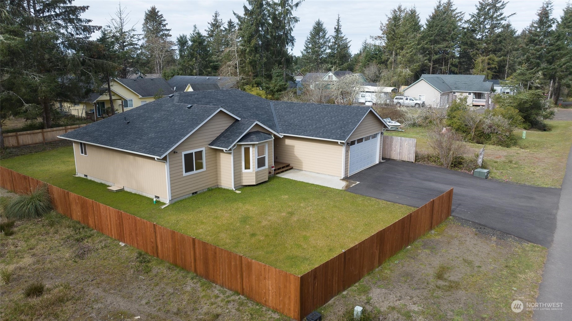 a aerial view of a house in a yard