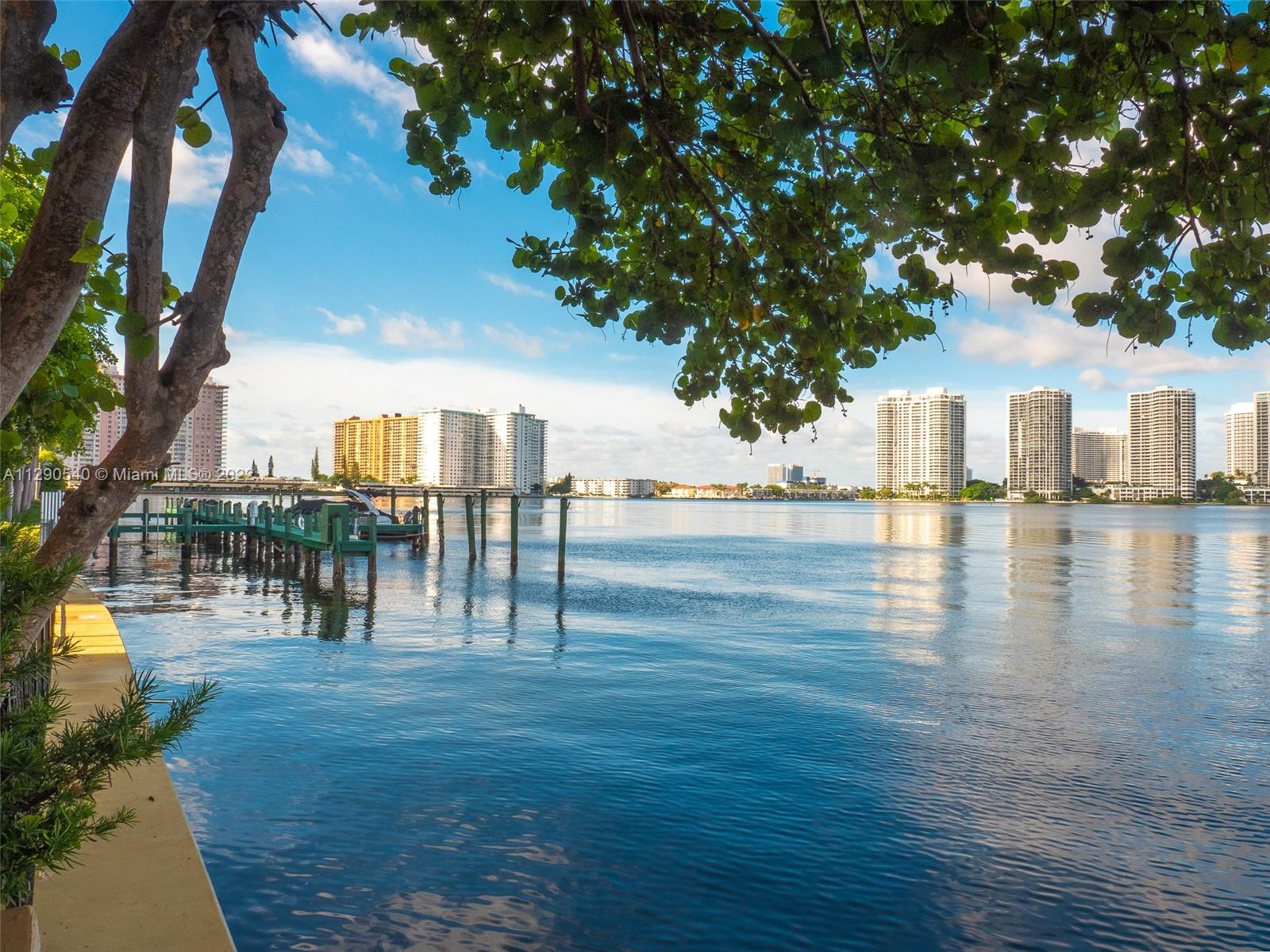 17878 North Bay Road, Unit 306 Sunny Isles Beach, FL 33160 - Photo 7 of 20 a view of residential houses with outdoor space and swimming pool