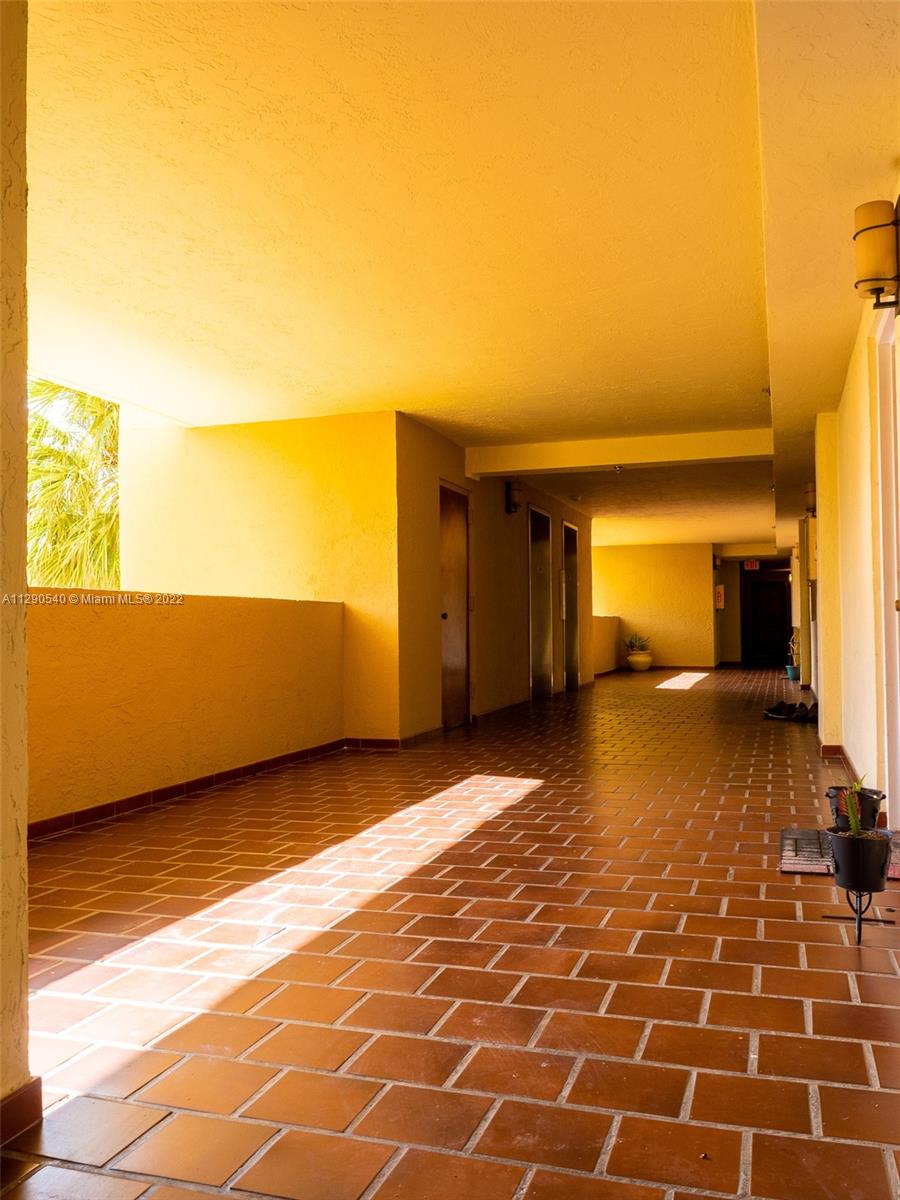 17878 North Bay Road, Unit 306 Sunny Isles Beach, FL 33160 - Photo 9 of 20 a view of a room with wooden floor and a rug