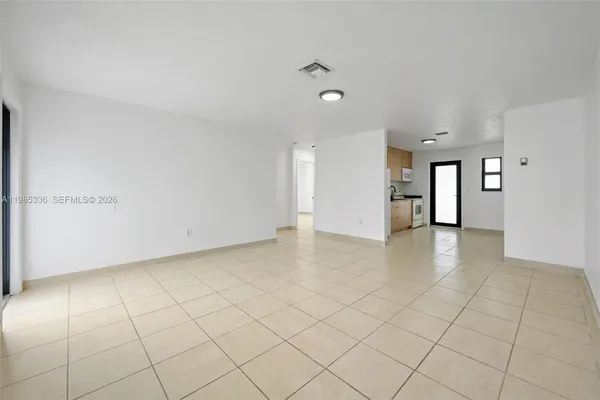 a view of an empty room and window