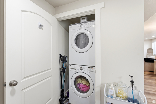 1434 West Stable Street Lindon, UT 84042 - Photo 47 of 76 Laundry area featuring stacked washer / drying machine and wood finished floors