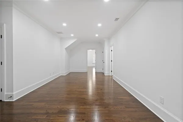 a view of backyard with swimming pool and seating space