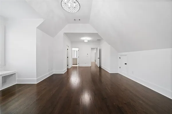 an aerial view of residential houses with outdoor space and street view