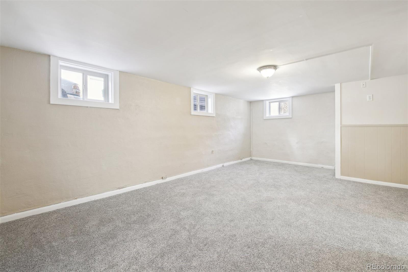 1462 Eudora Street Denver, CO 80220 - Photo 20 of 38 a view of an empty room with a window