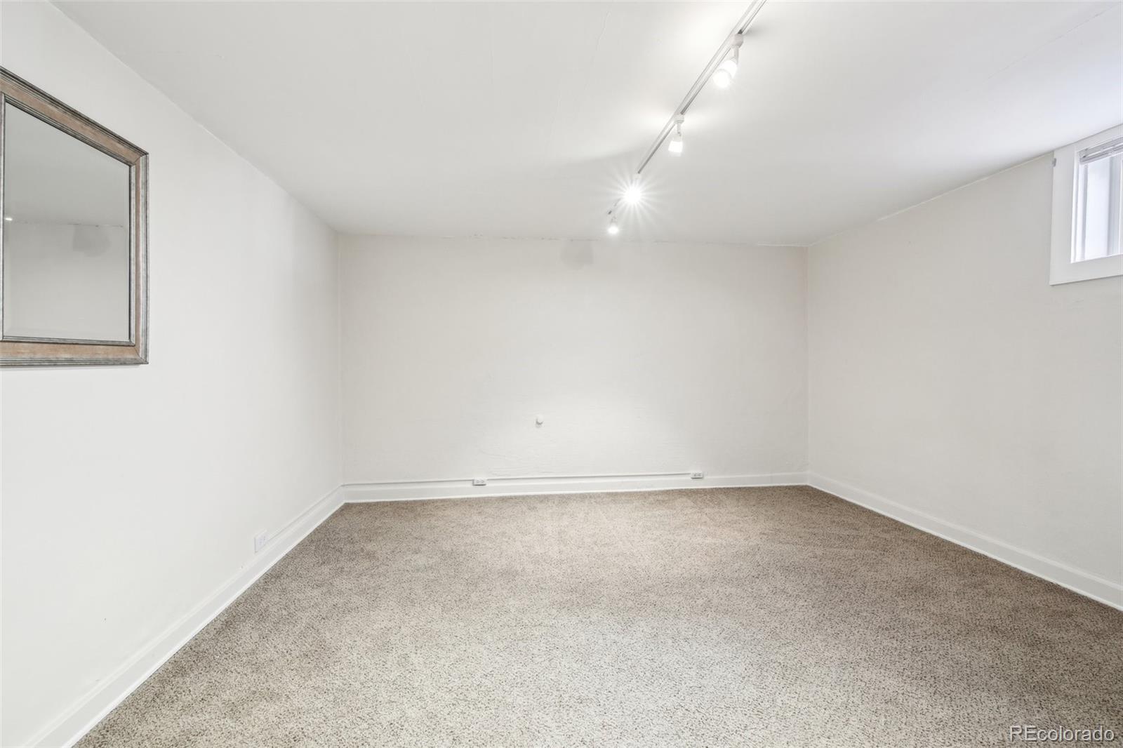 1462 Eudora Street Denver, CO 80220 - Photo 26 of 38 an empty room with a empty space and window
