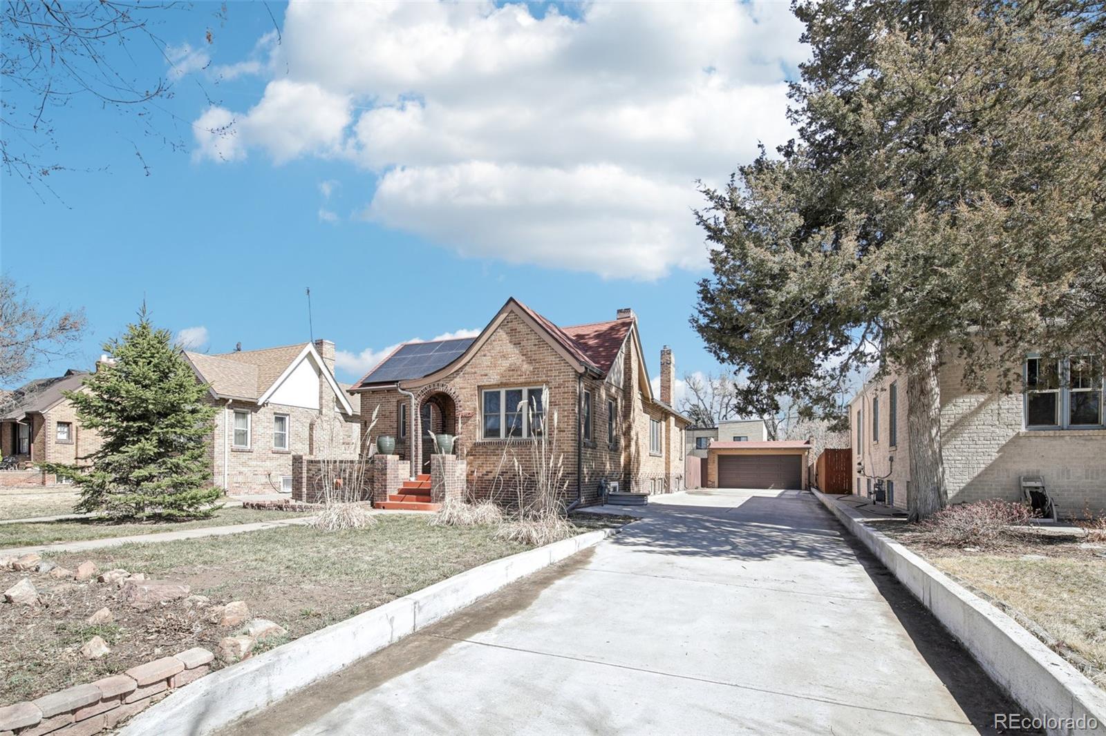 1462 Eudora Street Denver, CO 80220 - Photo 6 of 38 a front view of a house with a yard