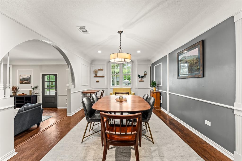 3116 Alexander Avenue Waco, TX 76708 - Photo 11 of 40 a dining room with furniture a chandelier and wooden floor