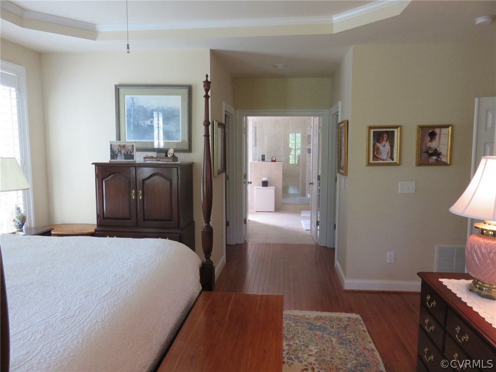 3624 Edenfield Road Midlothian, VA 23113 - Photo 14 of 25 a bedroom with a bed and wooden floor