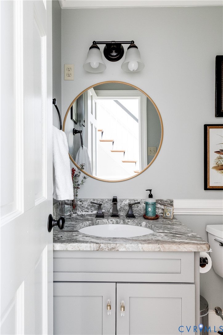 2021 Swamp Fox Road Midlothian, VA 23112 - Photo 16 of 73 a bathroom with a sink and a mirror
