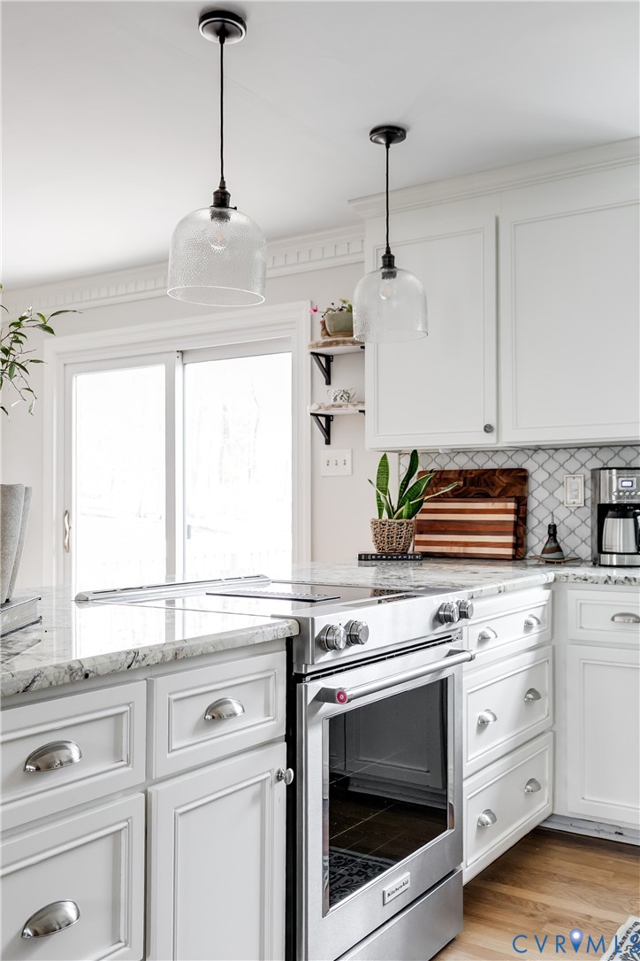 2021 Swamp Fox Road Midlothian, VA 23112 - Photo 22 of 73 a kitchen with appliances cabinets and a window