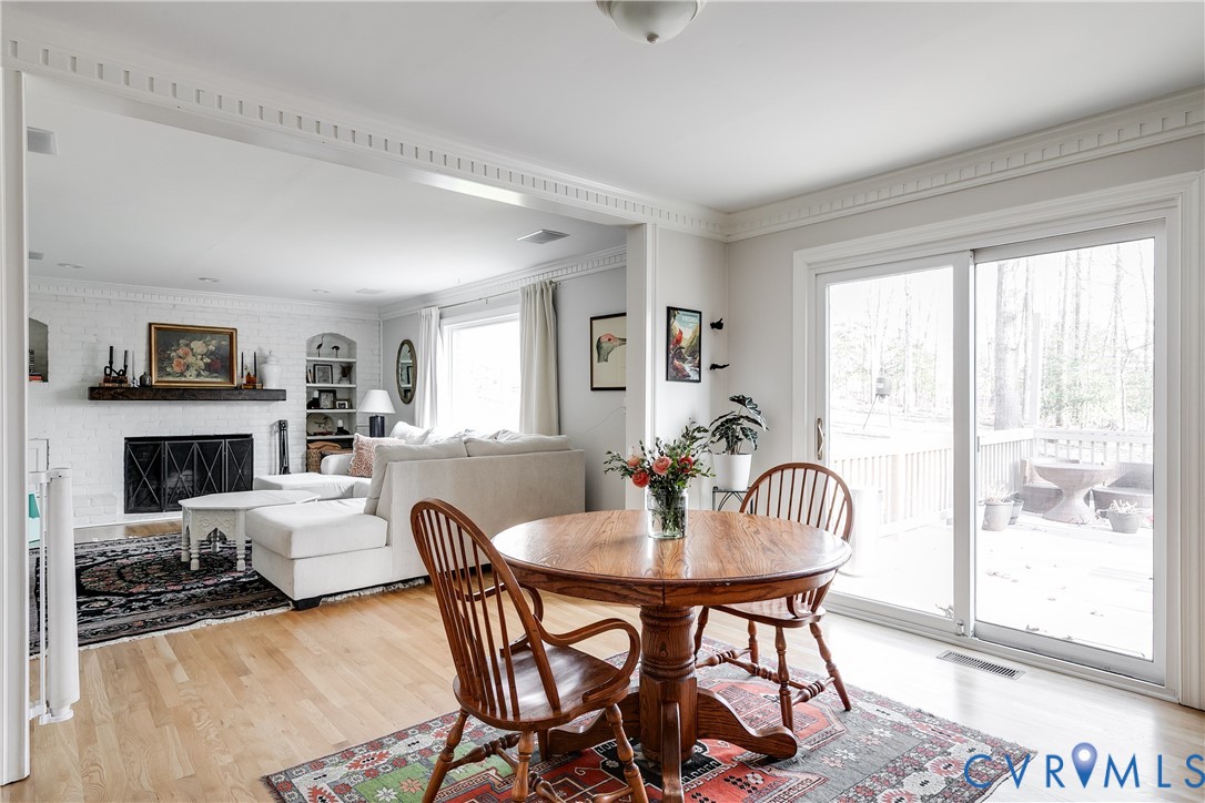 2021 Swamp Fox Road Midlothian, VA 23112 - Photo 27 of 73 a view of a dining room with furniture and a potted plant