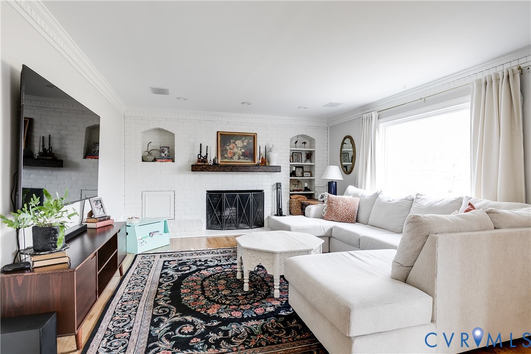 2021 Swamp Fox Road Midlothian, VA 23112 - Photo 28 of 73 a living room with furniture and a fireplace