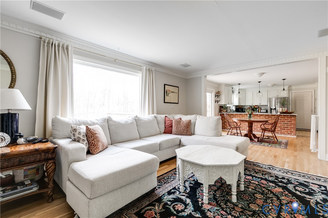 2021 Swamp Fox Road Midlothian, VA 23112 - Photo 33 of 73 a living room with furniture and a fireplace